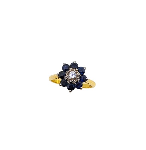 Lot 132 - A sapphire and diamond cluster ring