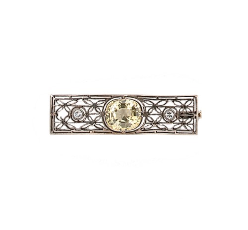 Lot 53 - An early 20th century yellow sapphire and diamond set brooch