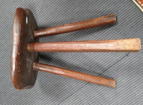 Lot 843 - A small elm rustic table with three legs and a...