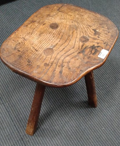 Lot 843 - A small elm rustic table with three legs and a...