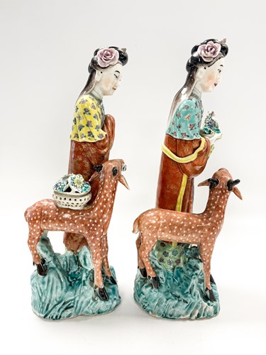 Lot 1 - Two similar Chinese enamelled porcelain figures of the Immortal Magu with deer, late Qing Dynasty