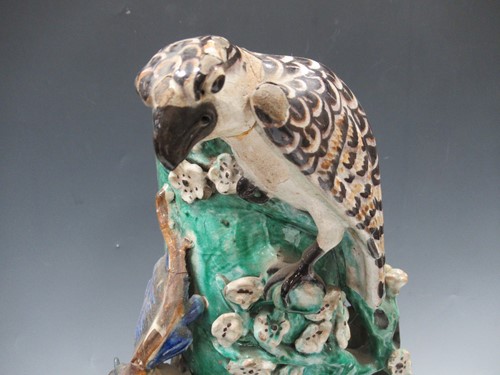 Lot 15 - An Oriental pottery vase decorated with a bird...