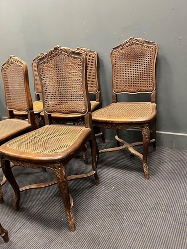 Lot 623 - A set of six French dining chairs with caned...