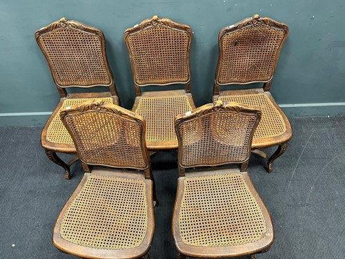Lot 623 - A set of six French dining chairs with caned...