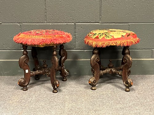Lot 717 - A pair of circular stools with needlework tops