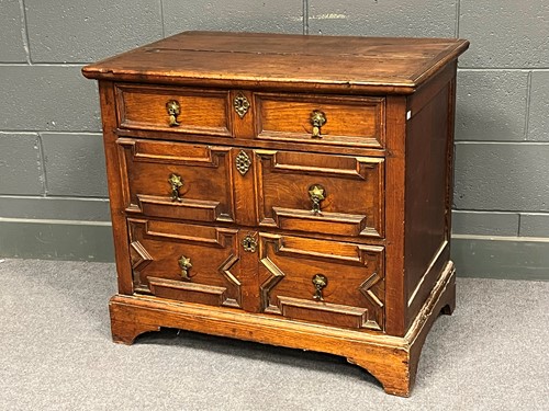Lot 716 - An 18th century oak chest of three long...