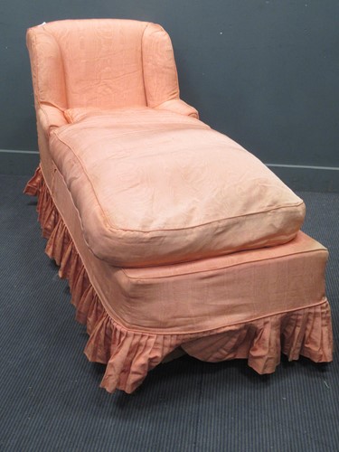Lot 681 - A day bed upholstered in a salmon pink satin...
