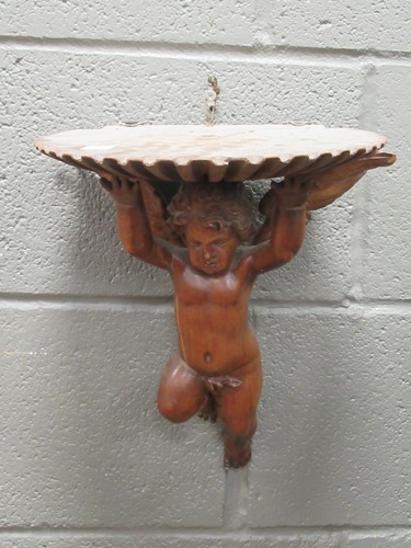 Lot 112 - A carved cherub bracket, 33 x 30 x 21cm