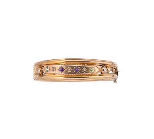 Lot 106 - An amethyst, peridot and diamond set bangle