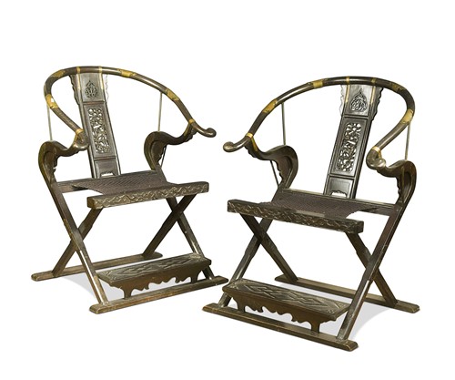 Lot 74 - A pair of Chinese hardwood folding armchairs, 20th century