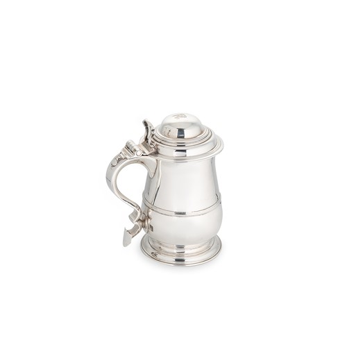 Lot 569 - A George II silver lidded tankard