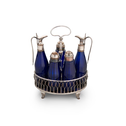 Lot 531 - A silver plated 5 bottle cruet stand with unusual blue glass bottles