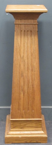 Lot 680 - An oak square section tapering plinth with...