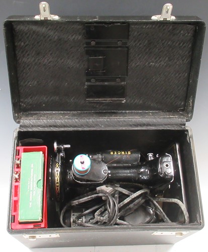 Lot 166 - A Singer 221K sewing machine, boxed with some...