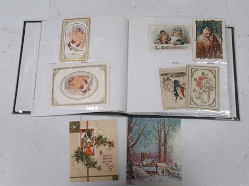 Lot 221 - An album of old greeting cards, early 20th...