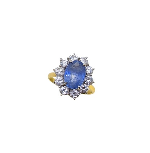 Lot 234 - An 18ct gold sapphire and diamond cluster ring