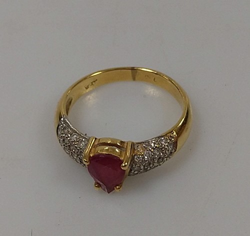 Lot 272 - A glass filled ruby and diamond ring, tested...
