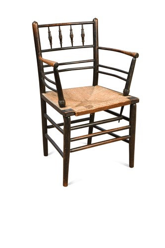 Lot 212 - Philip Webb for Morris & Co., a stained ash Sussex chair