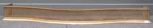 Lot 352 - A George III serpentine styled brass fender....