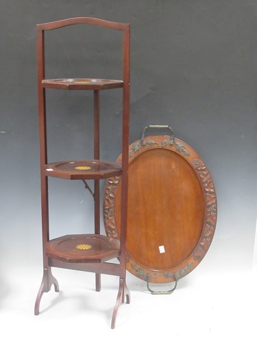 Lot 866 - A late Victorian oval walnut tray with leaf...