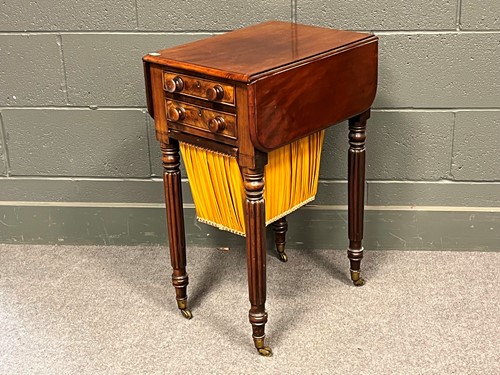Lot 723 - A William IV mahogany two drawer drop flap...