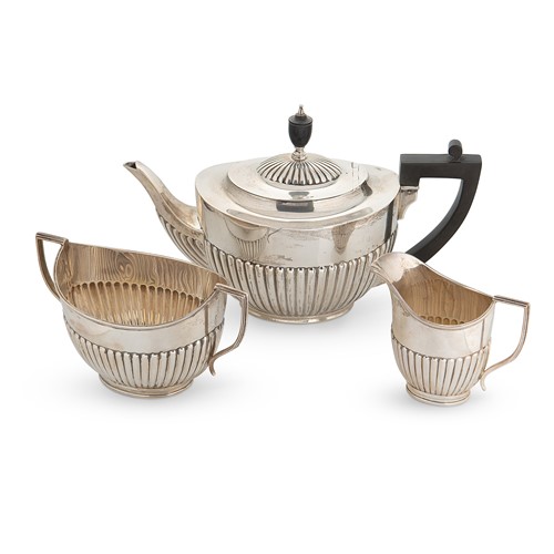 Lot 654 - A George V silver harlequin 3-piece tea set