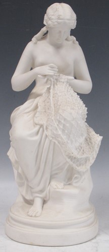 Lot 27 - A Parian figure of a woman mending a net,...