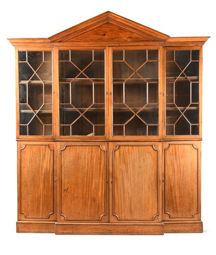 Lot 499 - A George III and later mahogany breakfront bookcase