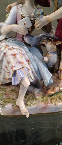 Lot 8 - A Meissen figure group “The Secret Letter”,...
