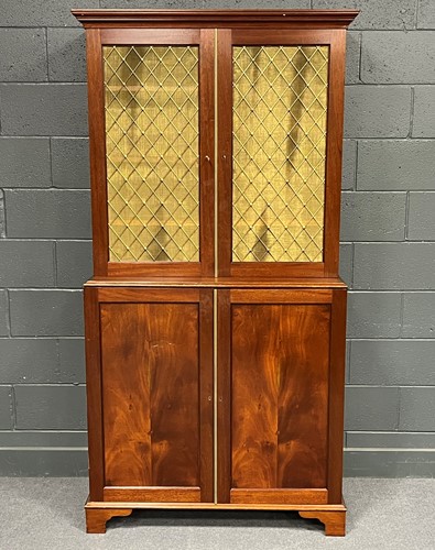 Lot 690 - A reproduction mahogany cabinet the upper part...