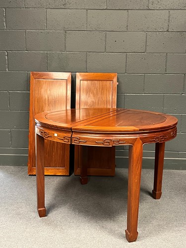 Lot 702 - A modern Chinese hardwood dining suite, to...