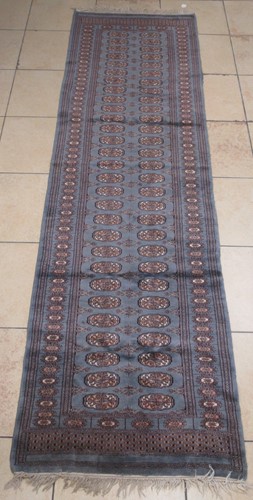 Lot 907 - 20th century silk runner in slate blue ground...