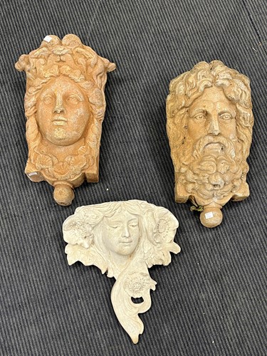 Lot 830 - Two composition classical style masks as wall...