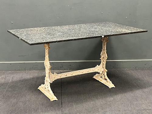Lot 811 - A rectangular granite top table on painted...