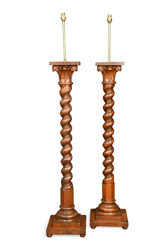 Lot 745 - A pair of stained pine column standard lamps, 20th century