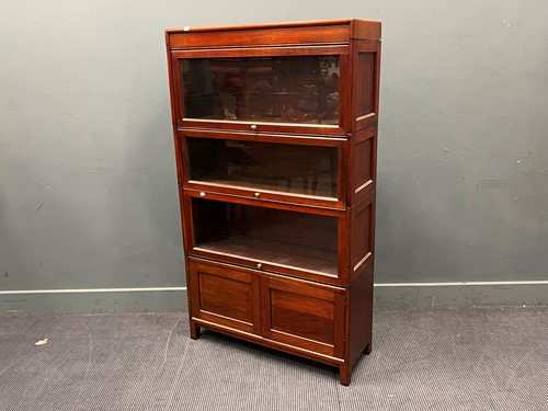 Lot 668 - A mahogany 4 section stacking bookcase, a...