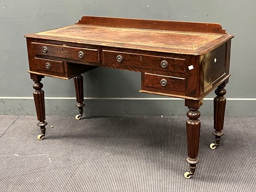 Lot 674 - A Victorian writing desk, with four drawers,...