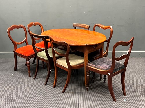 Lot 669 - An oval mahogany drop flap table, the top 120...