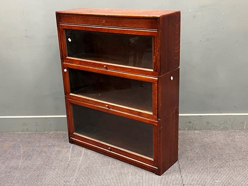 Lot 667 - A three section oak stacking bookcase