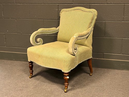 Lot 783 - An easy armchair with scroll arms, and an...