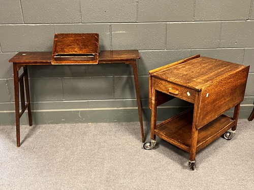 Lot 660 - An oak bed table with adjustable reading stand...