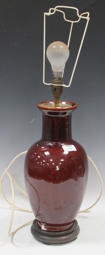 Lot 115 - A burgundy glazed ceramic lamp base, 63cm high...