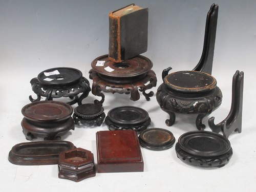 Lot 180 - A quantity of Chinese wooden stands for bowls...