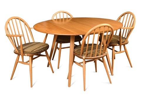 Lot 289 - An Ercol elm 'Windsor' drop-flap dining table and four chairs