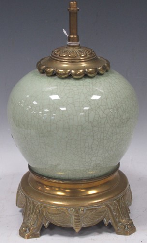 Lot 46 - A gilt metal mounted globular celadon table...