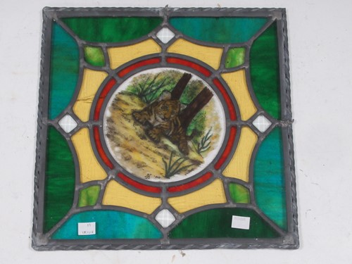 Lot 56 - A leaded stained glass panel with central...