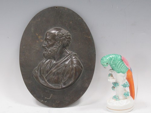 Lot 233 - A oval bronze relief plaque of St Peter,...