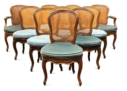Lot 824 - A set of ten Louis XV style walnut dining...
