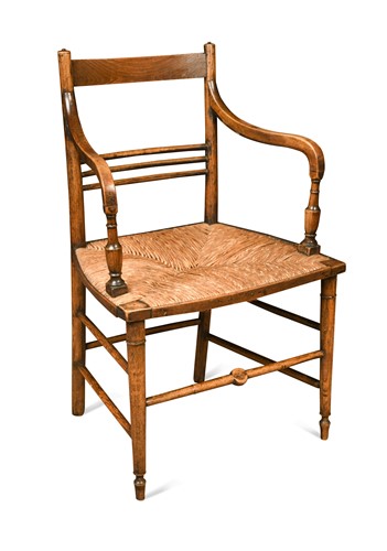 Lot 211 - A Morris style Arts & Crafts elbow chair