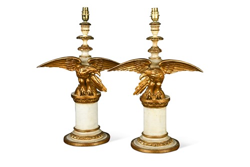 Lot 652 - A pair of carved wood eagle lamps